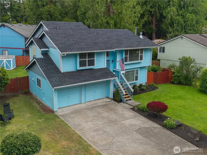 Bird's-eye perspective showcases exceptional curb appeal, generous outdoor space, and the home's attractive split-level design Bird's-eye perspective showcases exceptional curb appeal, generous outdoor space, and the home's attractive split-level design