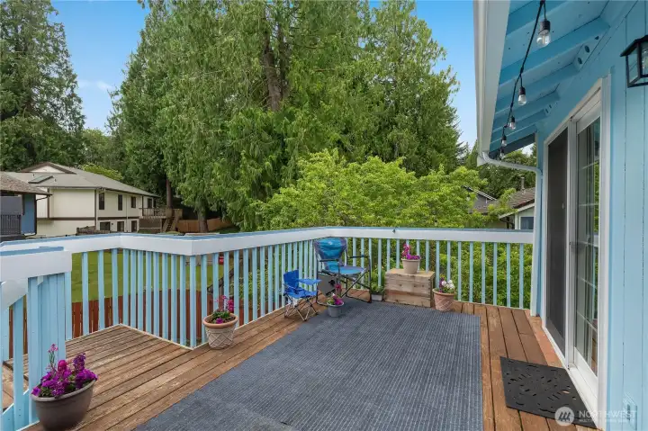 Enjoy morning coffee or evening gatherings on the expansive deck overlooking the private backyard and surrounding greenery Enjoy morning coffee or evening gatherings on the expansive deck overlooking the private backyard and surrounding greenery