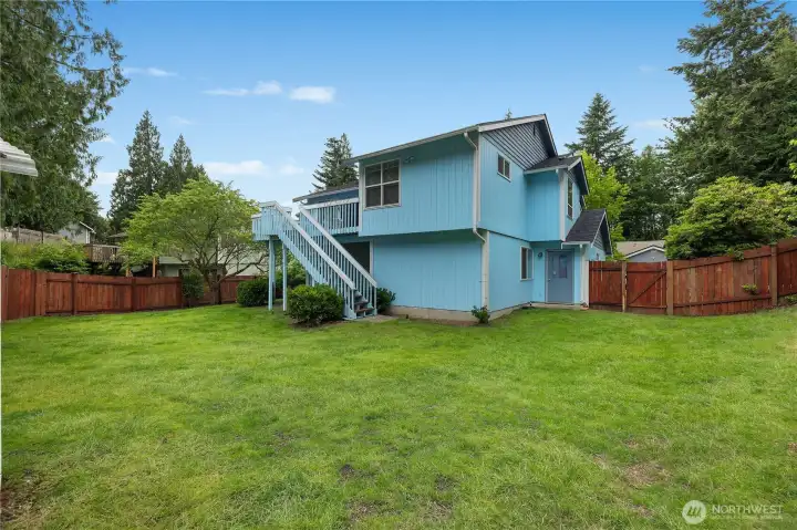 Enjoy outdoor gatherings, yard games, and summer barbecues in this spacious, fully fenced backyard Enjoy outdoor gatherings, yard games, and summer barbecues in this spacious, fully fenced backyard