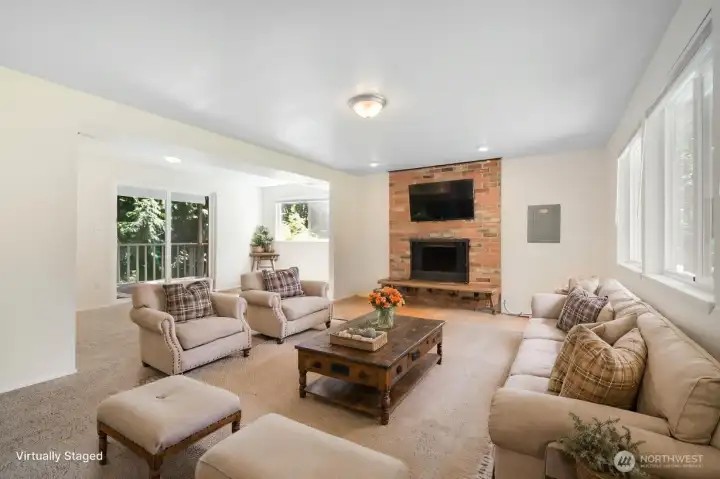 Huge Flex/bonus room with slider out to deck and wood burning fireplace
