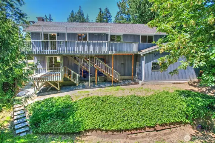 Back of the home partially fenced