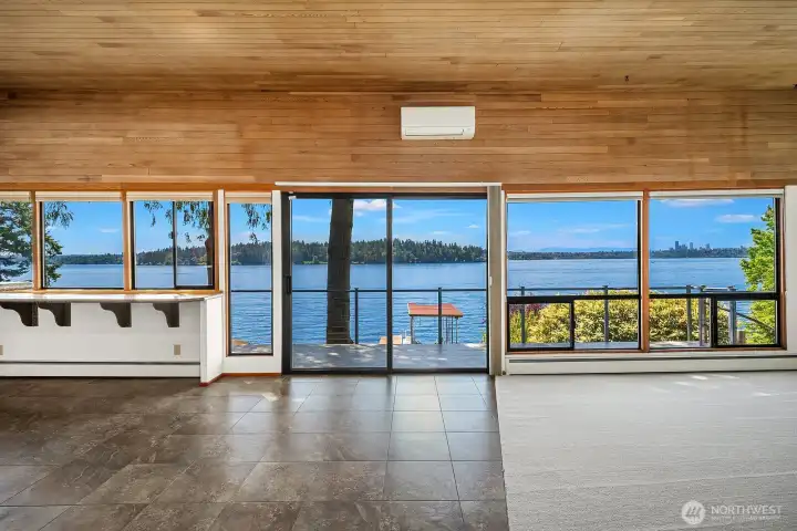 Savor panoramic scenery including the Seattle skyline & Seward Park with majestic Olympics rising in the background.