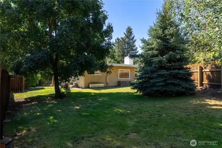 .24 AC corner lot boasts mature trees and green grass .24 AC corner lot boasts mature trees and green grass