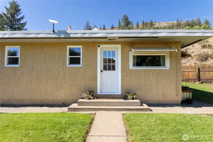 Bright and welcoming guest gate entrance. Sellers enter through side gate by driveway. Bright and welcoming guest gate entrance. Sellers enter through side gate by driveway.