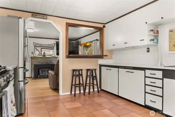 Bright kitchen with eat in breakfast bar and upgraded appliances and counter tops Bright kitchen with eat in breakfast bar and upgraded appliances and counter tops