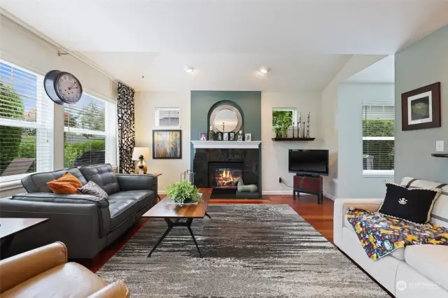 Light & bright living room with gas fireplace.