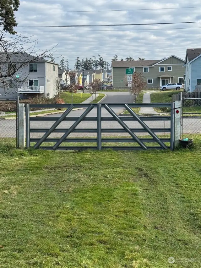 Street access to back of lot where large shop sits.