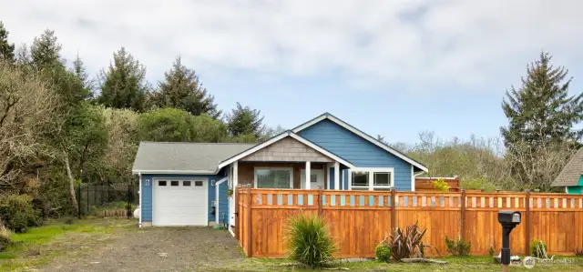 Beautiful classic cottage, covered porch and fully fenced, front and back.