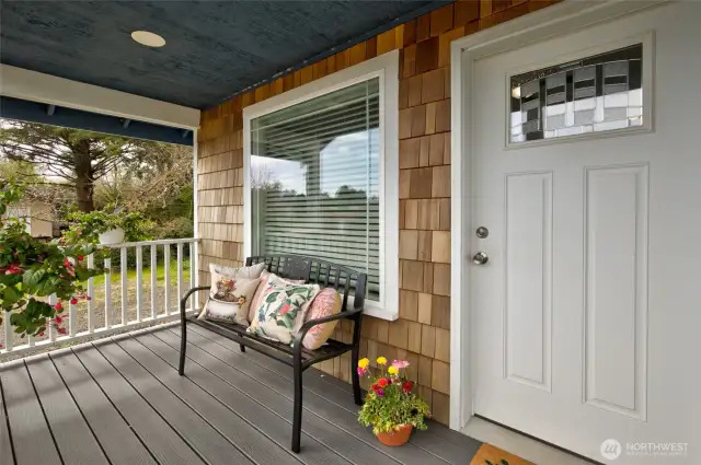 This cozy cottage welcomes you in with a covered front deck.