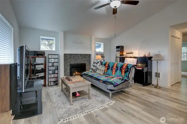 Cozy river rock propane fireplace.