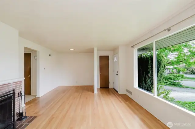 Original hardwood floors span the space
