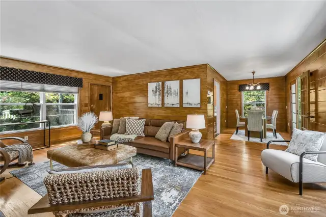 The living room and dining room still retain their original wood tongue and groove walls