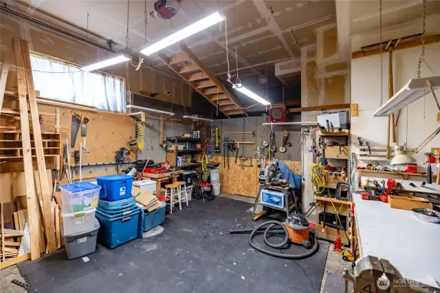 Lower level large garage with shop space and high ceilings...