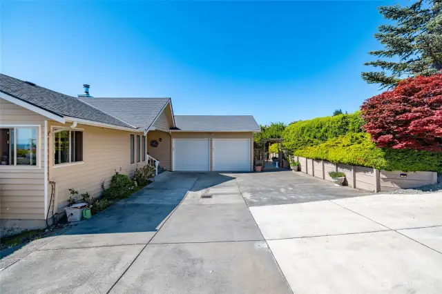 Accessible of of either street this two car garage walks in through the utility room to main level living...