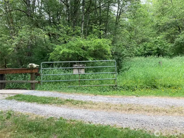 Subject property is to the right of the road.