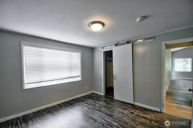 Another view of the primary bedroom