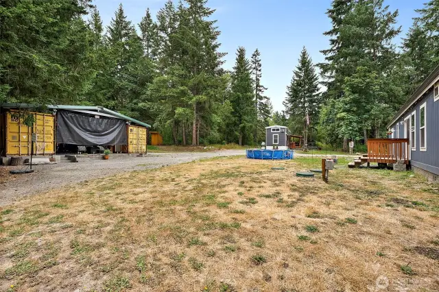 Custom container storage and outdoor entertainment area for year round outdoor enjoyment!