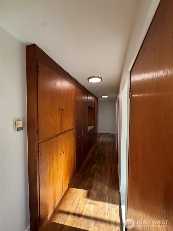 Hallway to bedrooms & bathroom w/tons of built-in storage