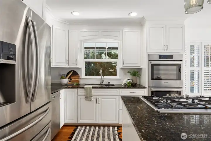 With a beautiful view out the kitchen window, abundant storage, and stainless appliances - this kitchen is truly the heart of the home, and will be a space to gather & create memories for years to come.