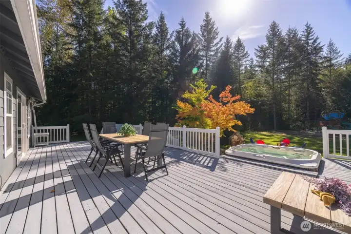 The south facing porch will be your favorite place to unwind. Elevated, with access off the dining room and room for everyone, you'll soon realize that it's easy to find any excuse to spend time on the back deck.