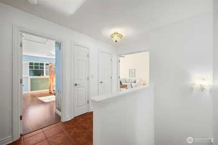 Upstairs, you'll find three bedrooms and a large oversized bonus room with vaulted ceilings (at the end of the hall).
