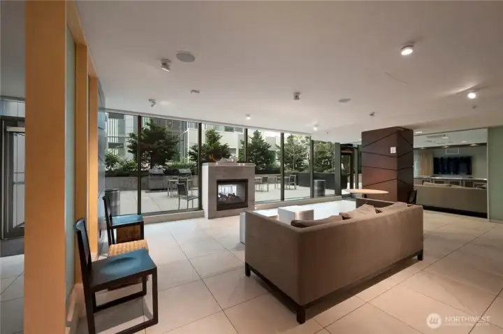 The community room has places to lounge and watch a big screen tv