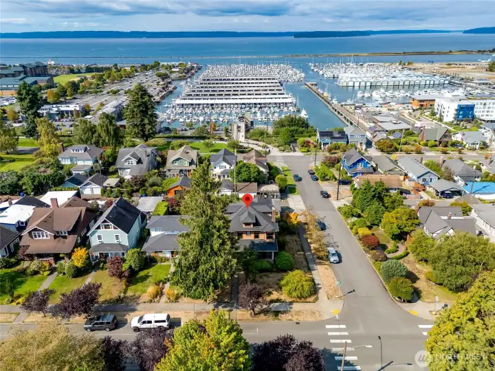 Aerial view showcasing the home's prime North Everett location with sweeping views of the Puget Sound, marina, and Jetty Island.