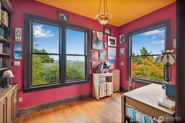 Mail floor office with oversized windows framing breathtaking western views of the Puget Sound and Jetty Island.