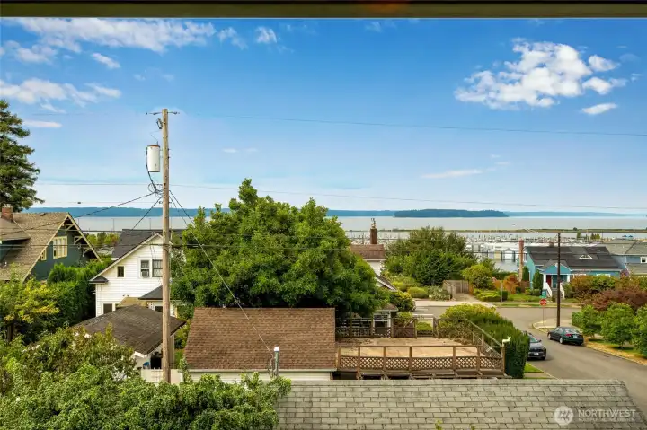 Sweeping water views from the property, looking out over the neighborhood toward Puget Sound and Jetty Island.