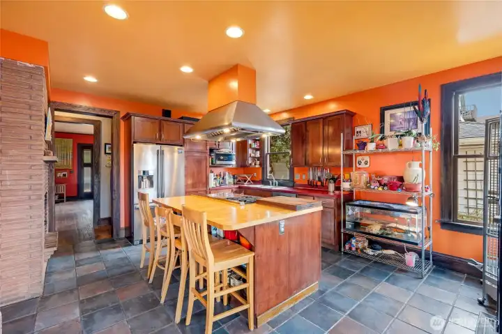 Kitchen with center island, stainless appliances, and an eating nook — perfect for everyday living and entertaining.