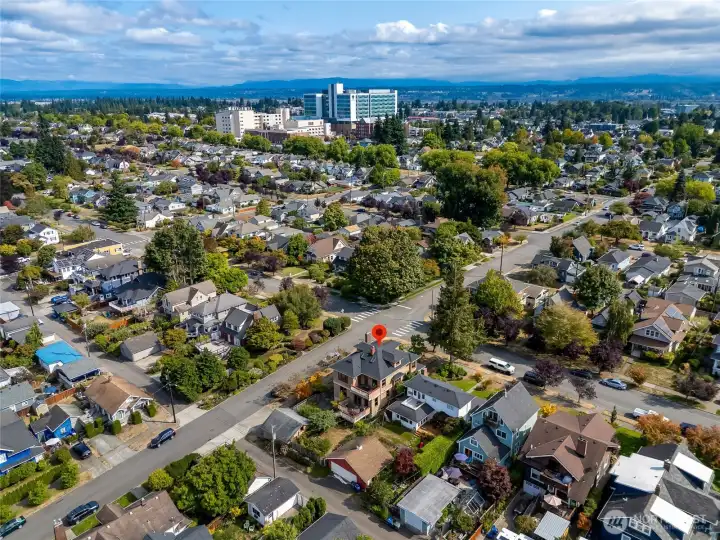Aerial view highlighting the home's convenient proximity to Providence Hospital, Downtown Everett, and the surrounding tree-lined North Everett neighborhood.