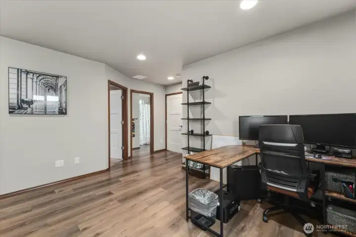 Lower level second living room w/ kitchen.