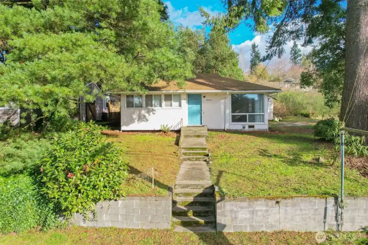 Bright and welcoming curb appeal with plenty of sunshine.