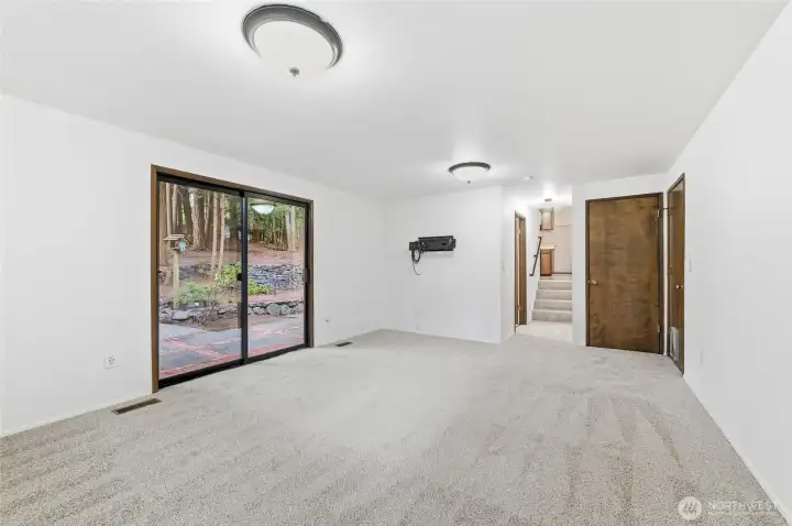 Family room n the lower level, patio door to the left