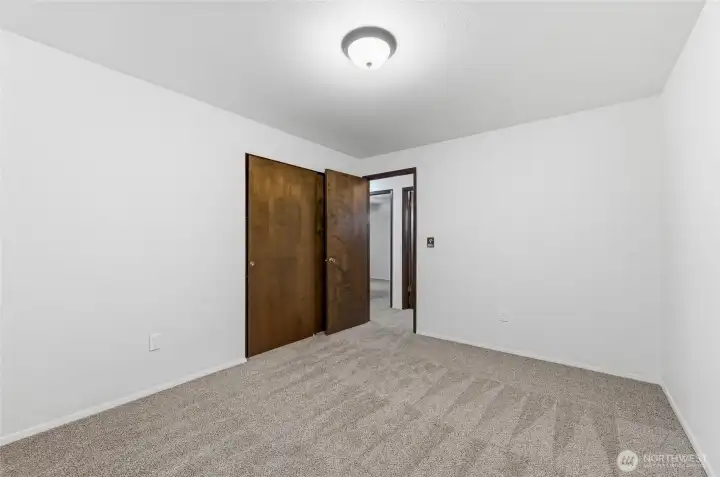 Bedroom #2 with new carpet, fresh paint and new window.