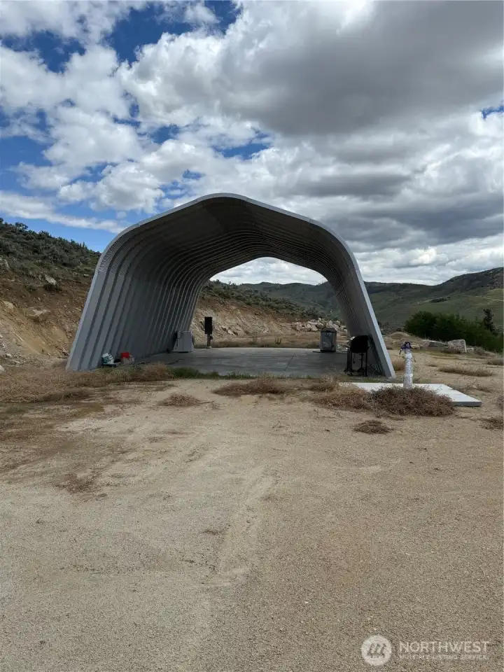 Great shelter on concrete slab with utilities adjacent.