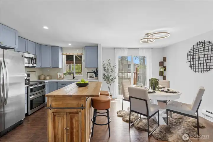 Updated kitchen with island with double oven quartz counters.