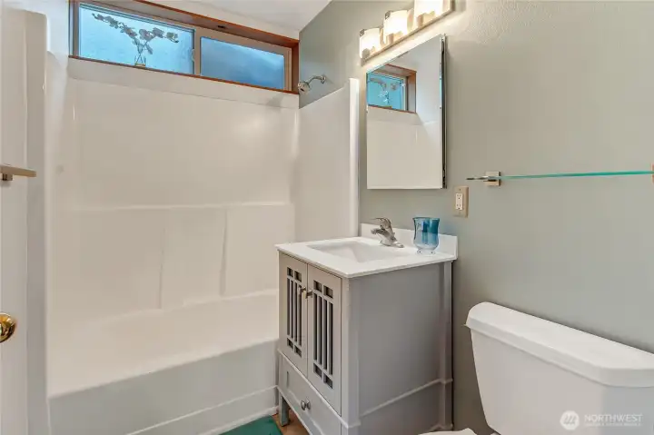 Guest bathroom with shower and tub.