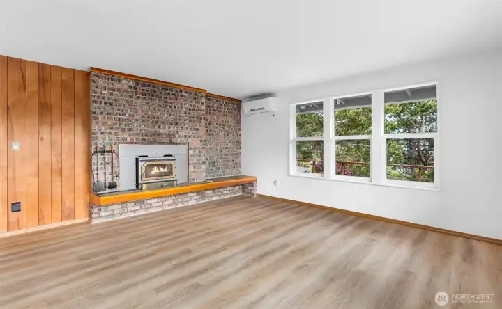Handsome brick work surrounds the wood burning fireplace insert Handsome brick work surrounds the wood burning fireplace insert