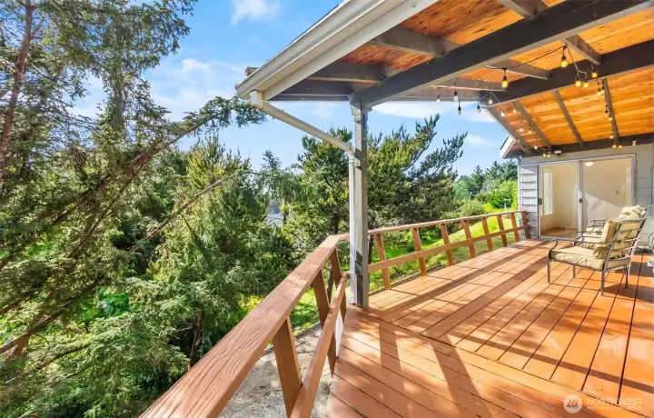 which leads around to the west side covered deck which leads around to the west side covered deck