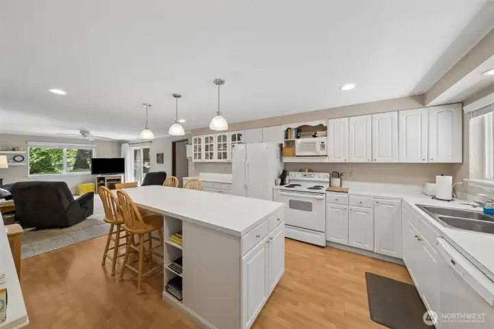 Large kitchen with convenient eating space.