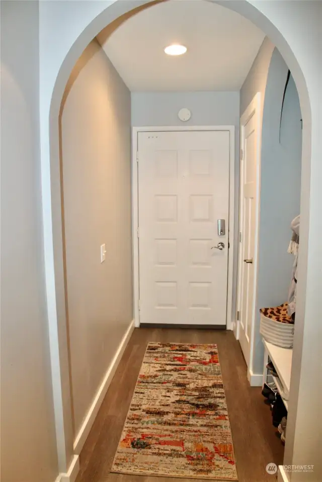 From living room looking back at front door and entry space.