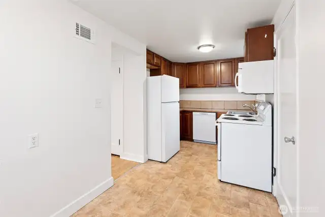 Door to the right leads to a separate entrance and large mudroom with washer and dryer.