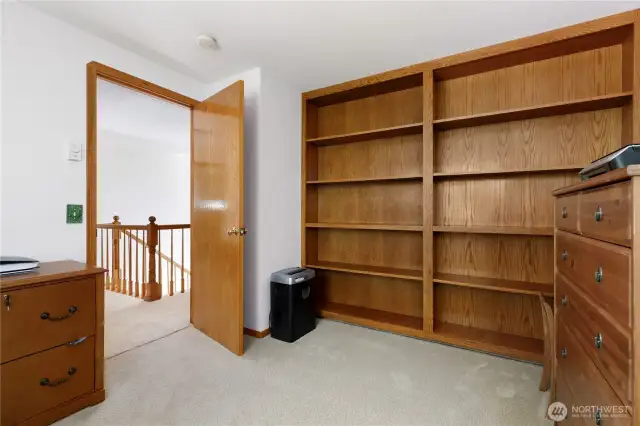 Custom built-in wood shelving in office