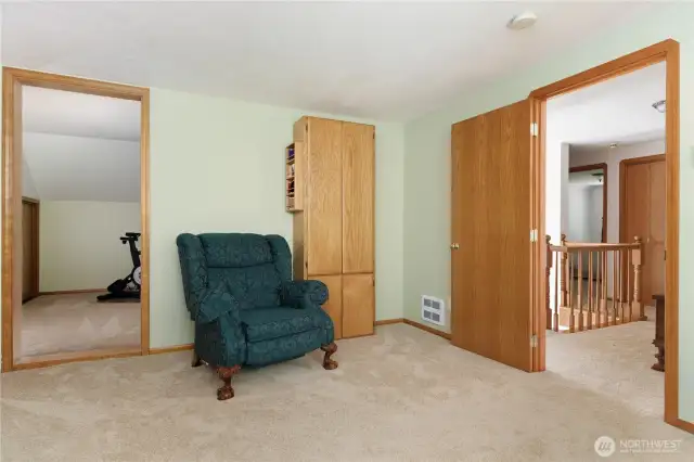 Upstairs Bedroom looking into current exercise room/flex space/playroom with attic access