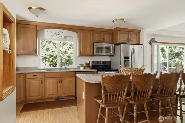 The heart of the home - huge Kitchen Island and bar with seating for 4-6