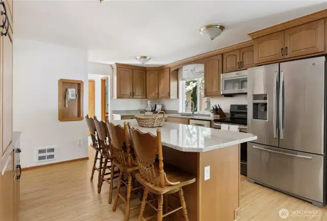 Kitchen Island looking into hall with powder bath on right