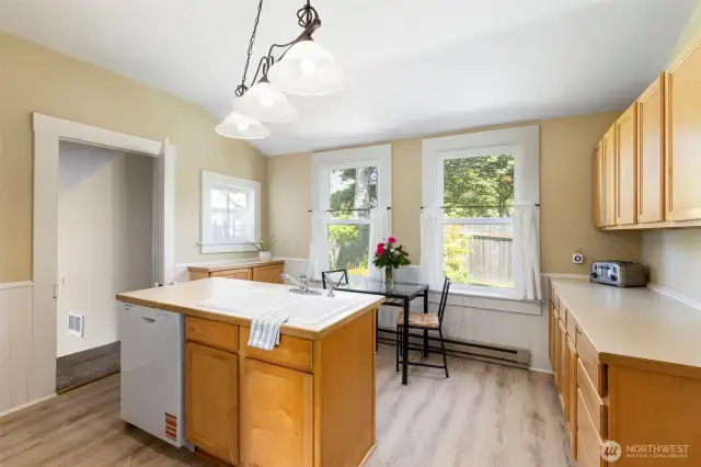 Kitchen with center island.  Door to the left takes you to primary suite.