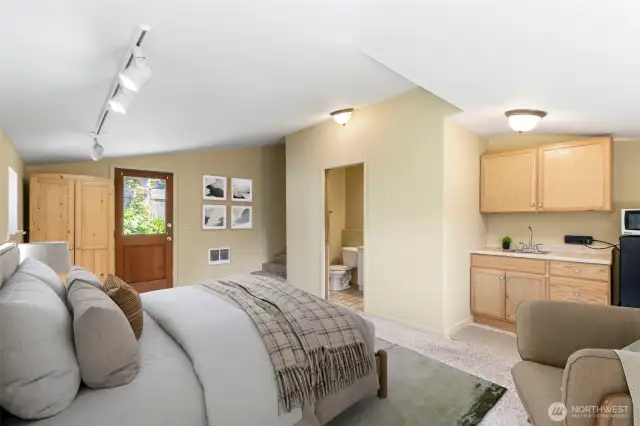 Primary bedroom has a separate entrance, 3/4 bath and mini kitchen area. Virtually staged.