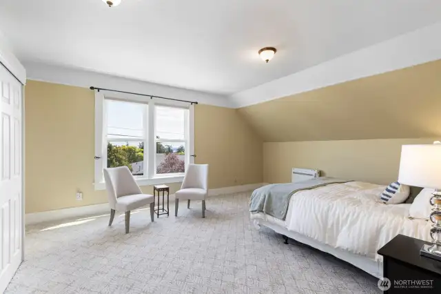 Large bedroom upstairs, could be primary with views of peek a boo views of the Bay.